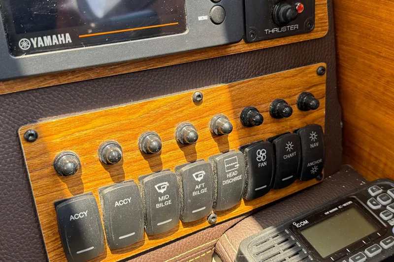 Slide: The Image of Control panel of 2025 Ranger Tugs R-23 boat with Yamaha display and switches. - 23