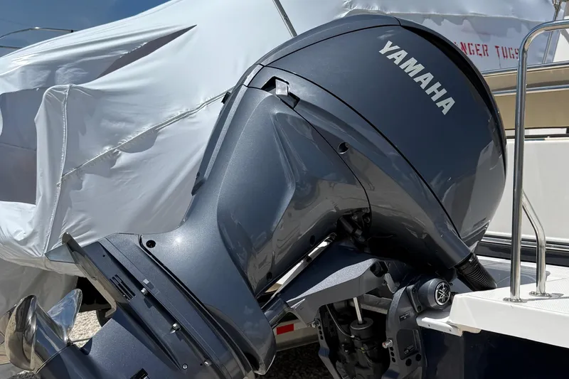 Slide: The Image of Yamaha outboard motor on 2025 Ranger Tugs R-23 boat, partially covered. - 7
