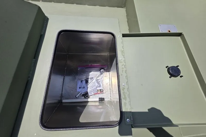 Slide: The Image of Open storage compartment in 2026 Weldcraft 1648 UV/DD ECONO Bass boat. - 12