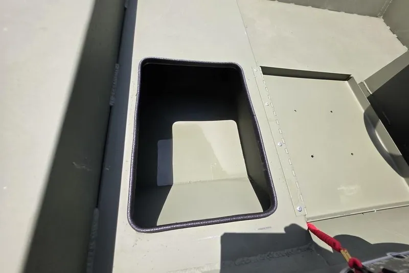 Slide: The Image of Interior view of 2026 Weldcraft 1648 UV/DD ECONO Bass boat compartment. - 17