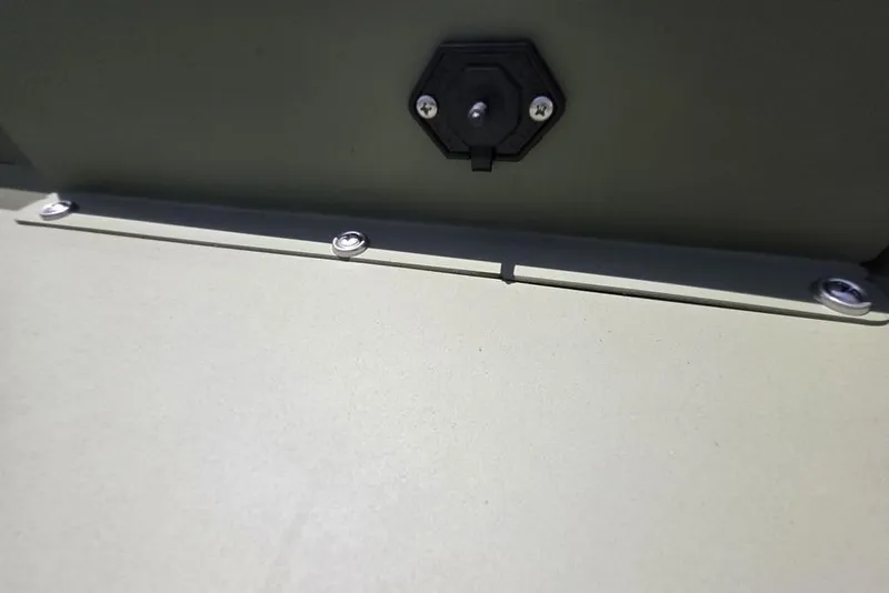 Slide: The Image of Close-up of 2026 Weldcraft 1648 UV/DD ECONO Bass boat detail, featuring screws and a switch. - 22