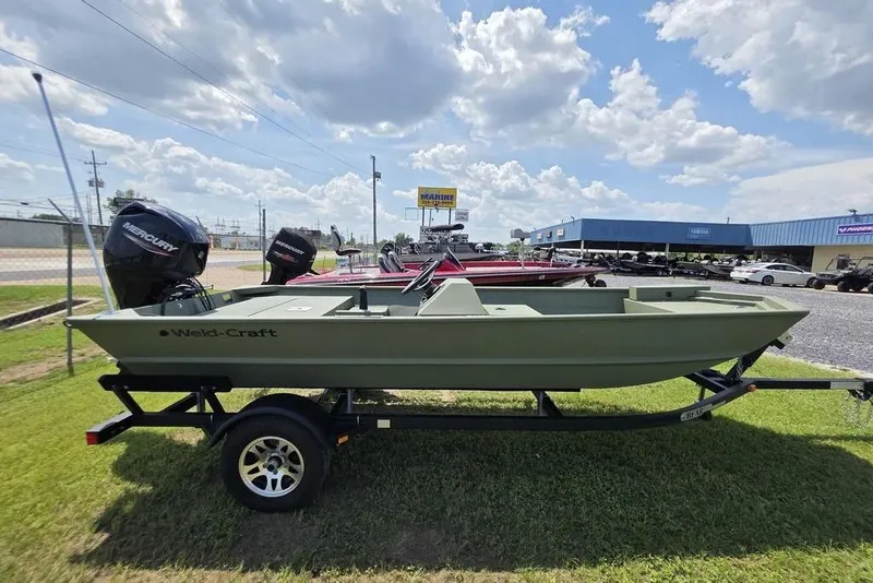 Slide: The Image of 2026 Weldcraft 1648 UV/DD ECONO Bass boat on trailer, parked outdoors. - 29