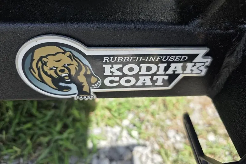 Slide: The Image of Sticker of rubber-infused Kodiak Coat on Weldcraft 1648 UV/DD ECONO Bass, 2026 model. - 5