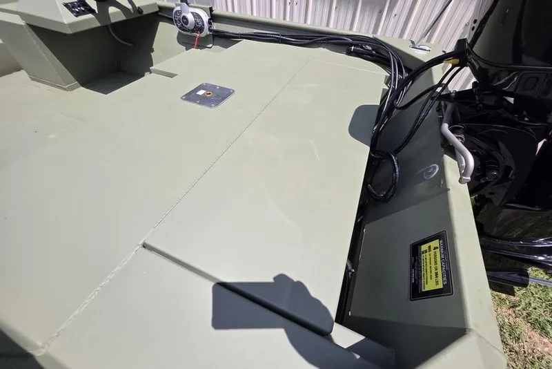 Slide: The Image of 2026 Weldcraft 1648 UV/DD ECONO Bass boat interior with motor and control panel. - 7