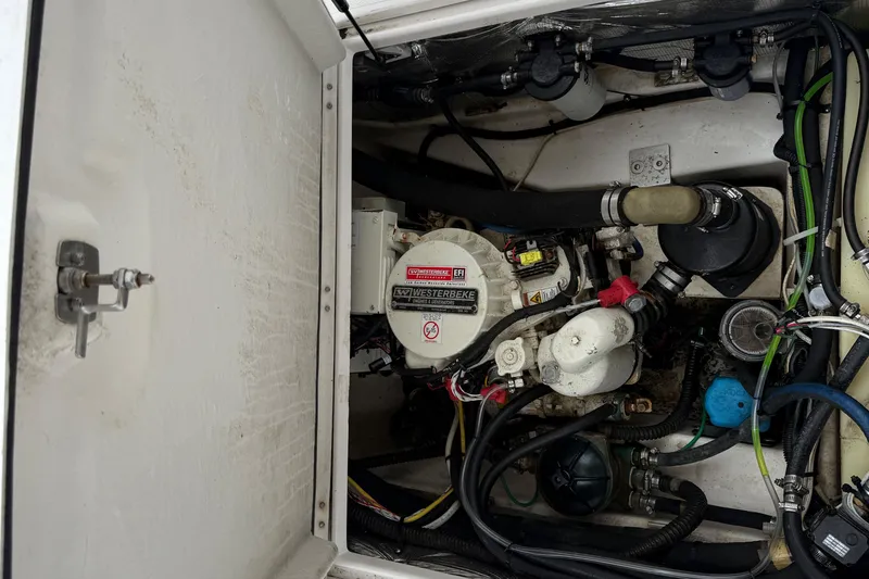 Slide: The Image of Engine compartment of a 2017 Cutwater C24 boat, featuring a Westerbeke generator. - 13