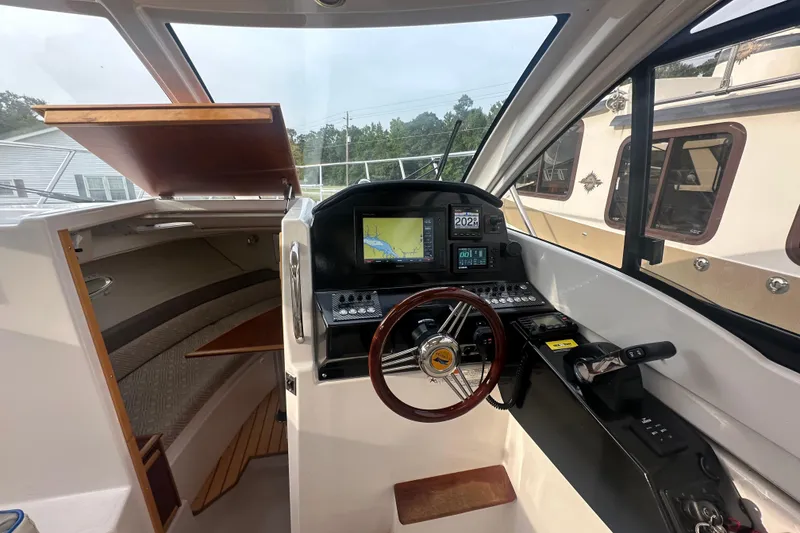 Slide: The Image of 2017 Cutwater C24 boat interior with navigation controls and steering wheel. - 7