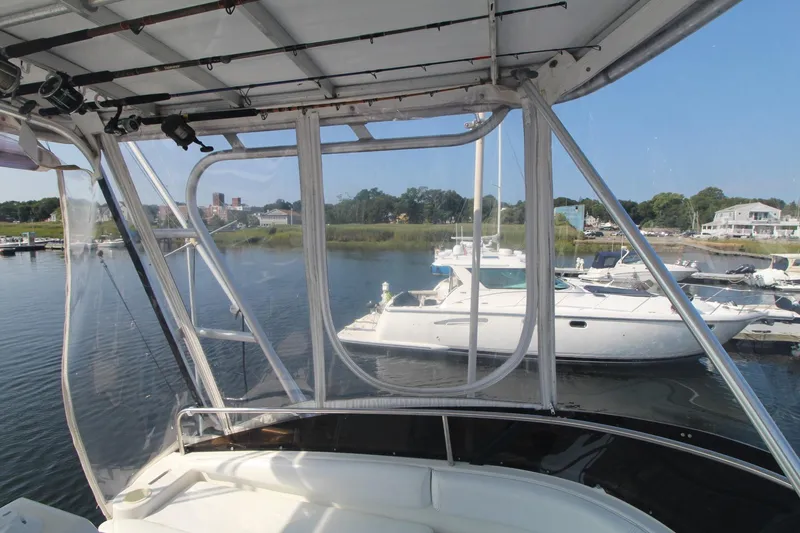 Slide: The Image of 1996 Silverton 41 Convertible yacht docked at marina, view from interior helm. - 14