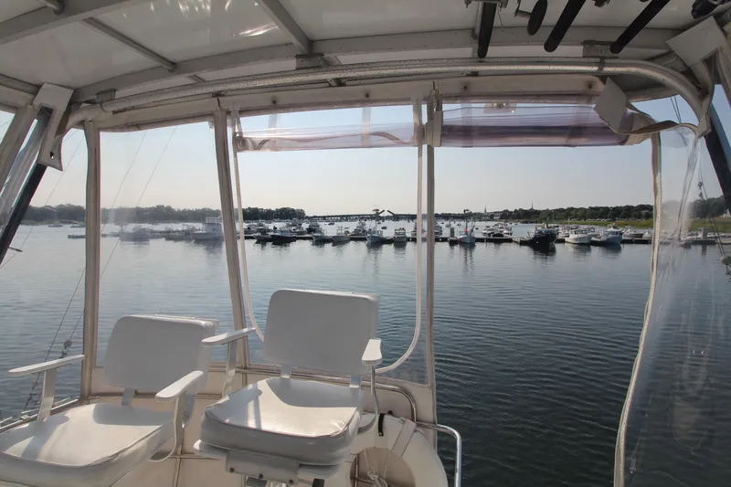 Slide: The Image of 1996 Silverton 41 Convertible yacht interior with marina view. - 17