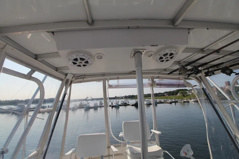 Slide: The Image of 1996 Silverton 41 Convertible boat interior with marina view through windows. - 22