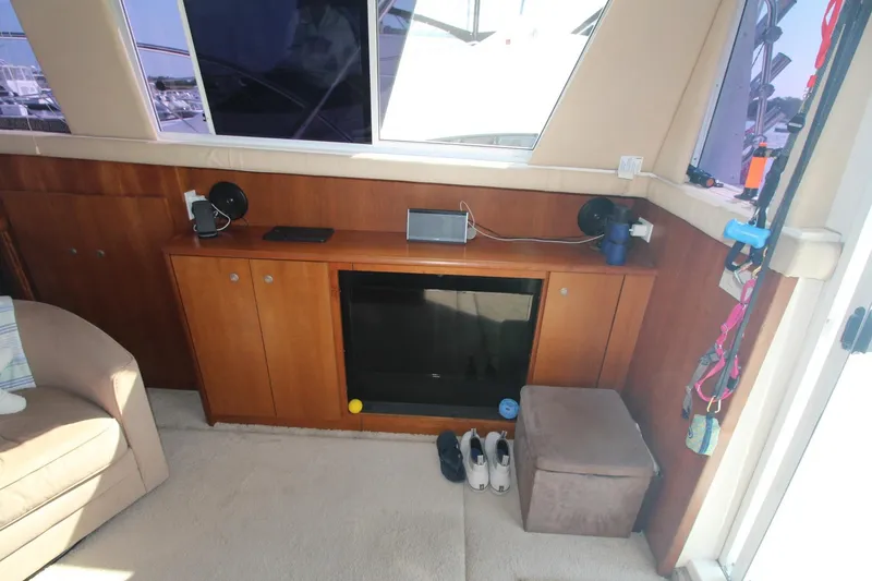 Slide: The Image of Interior of 1996 Silverton 41 Convertible yacht with wooden cabinetry and modern amenities. - 26