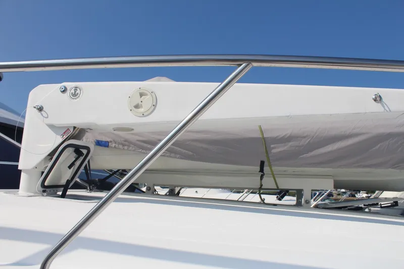 Slide: The Image of 1996 Silverton 41 Convertible yacht deck with railing under clear blue sky. - 3