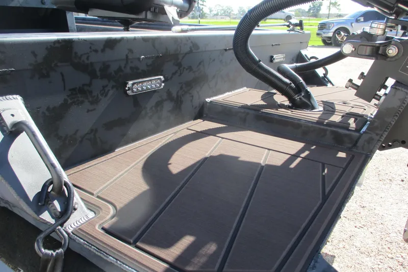 Slide: The Image of 2026 Gator Tail 2054 EXTREME CC boat deck with durable flooring and equipment. - 12
