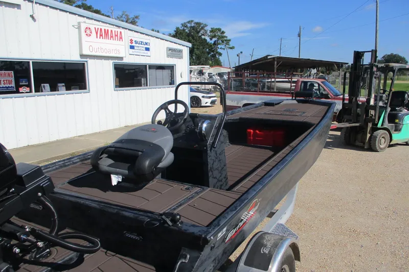 Slide: The Image of 2026 Gator Tail 2054 EXTREME CC boat at dealership, featuring Yamaha and Suzuki signage. - 2