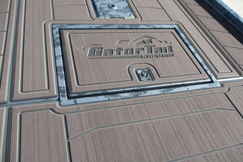 Slide: The Image of 2026 Gator Tail 2054 EXTREME CC boat deck with logo and textured surface. - 6