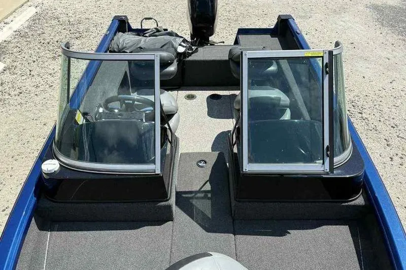 Slide: The Image of 2017 Triton 168 DV boat interior with dual windshields and seating. - 9