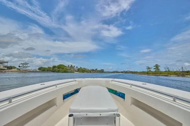 Slide: The Image of Invincible 36 boat, 2015 model, cruising on a sunny day with clear skies. - 28