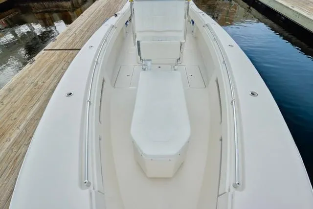 Slide: The Image of Garmin radar on 2015 Invincible 36 boat, docked near a warehouse and palm trees. - 9