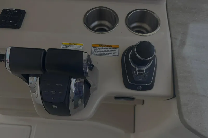 Slide: The Image of Control panel of a 2020 Boston Whaler 350 Realm boat with throttle and joystick. - 22