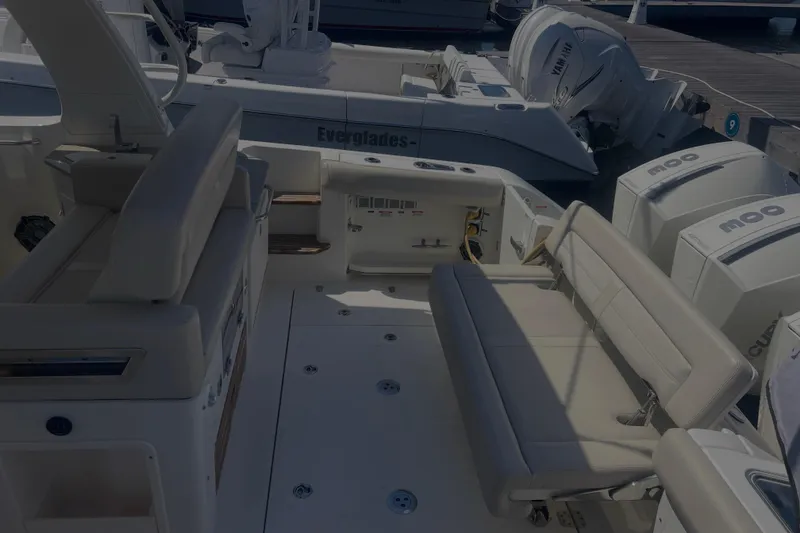 Slide: The Image of 2020 Boston Whaler 350 Realm boat interior with seating and outboard engines. - 34