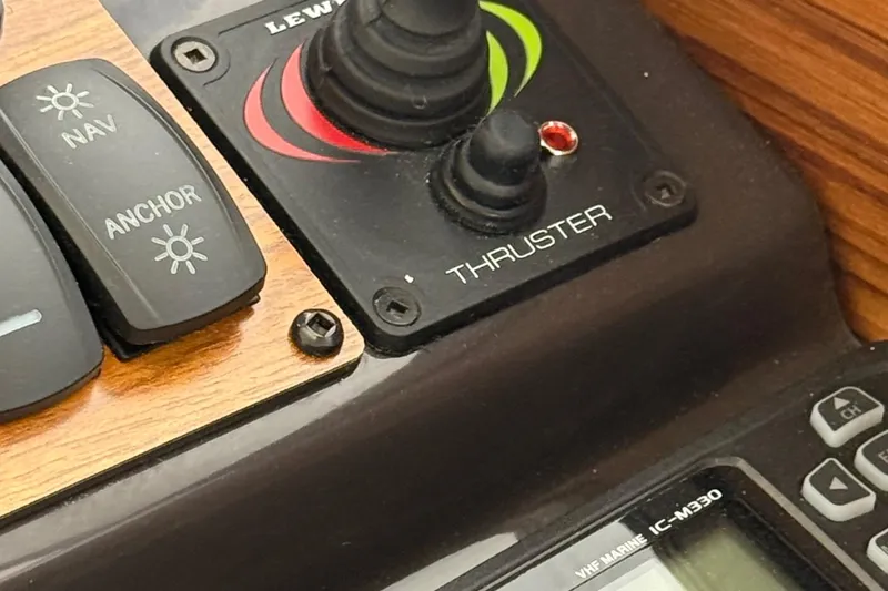 Slide: The Image of Control panel of 2025 Ranger Tugs R-25 with thruster and navigation switches. - 25