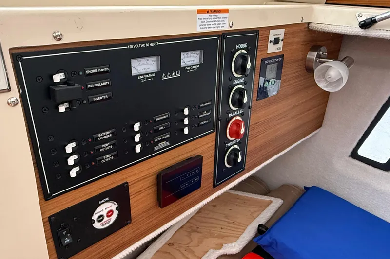 Slide: The Image of Control panel of 2025 Ranger Tugs R-25 boat with switches and gauges. - 43