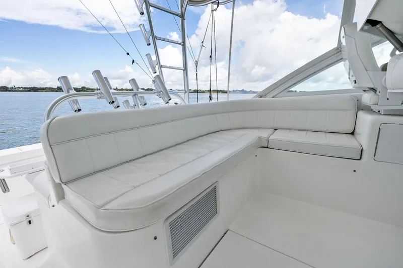 Slide: The Image of 2004 Cabo 40 Hardtop Express yacht with white leather seating and ocean view. - 11