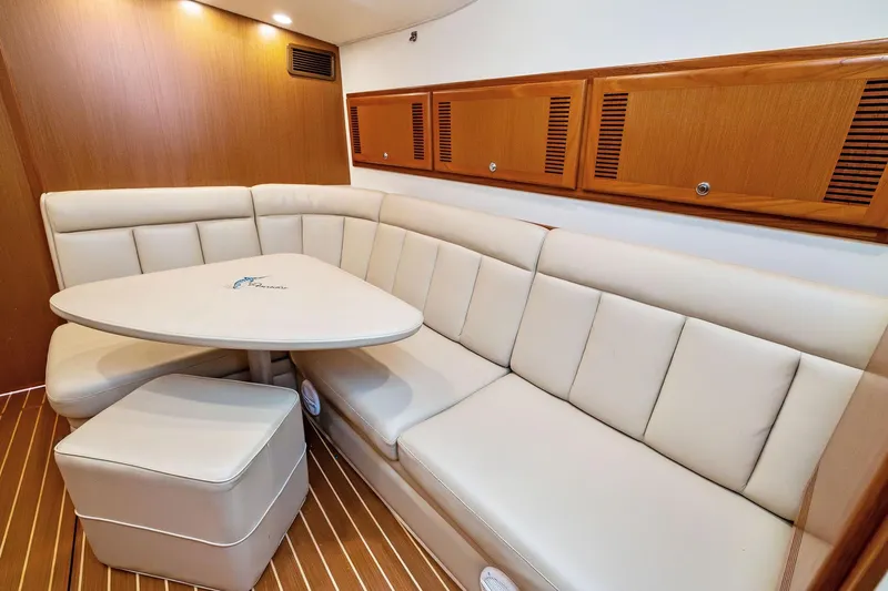 Slide: The Image of Luxurious interior of 2004 Cabo 40 Hardtop Express yacht with cream leather seating. - 20