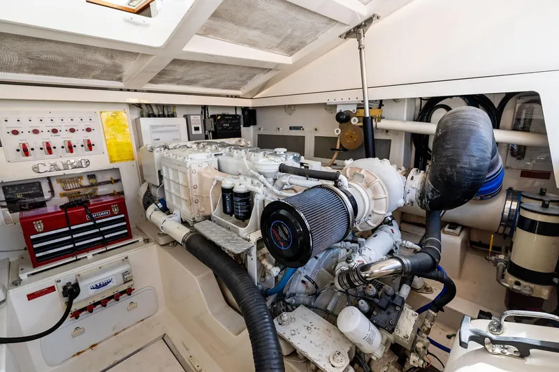 Slide: The Image of Engine room of 2004 Cabo 40 Hardtop Express, showcasing detailed mechanical components. - 36