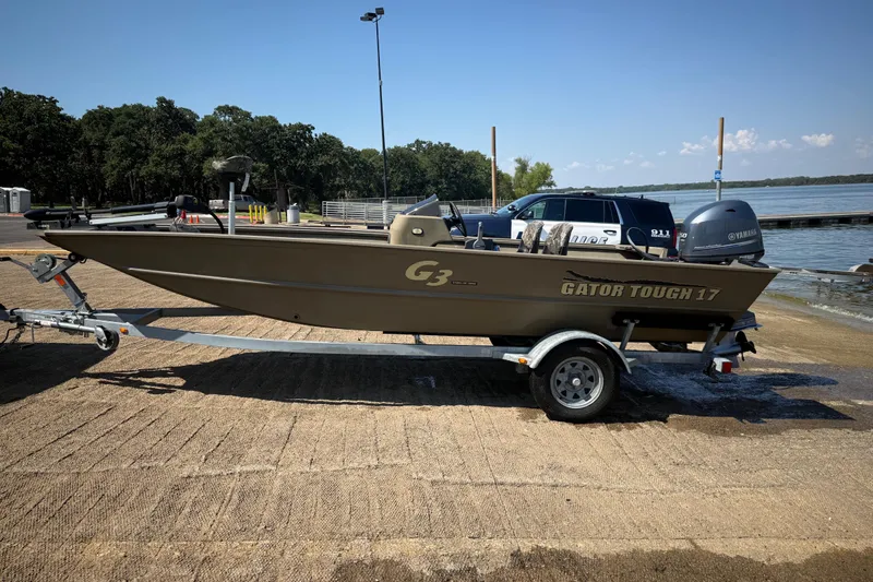 Slide: The Image of 2020 G3 Gator Tough 17 SC boat on trailer at lakeside ramp. - 15