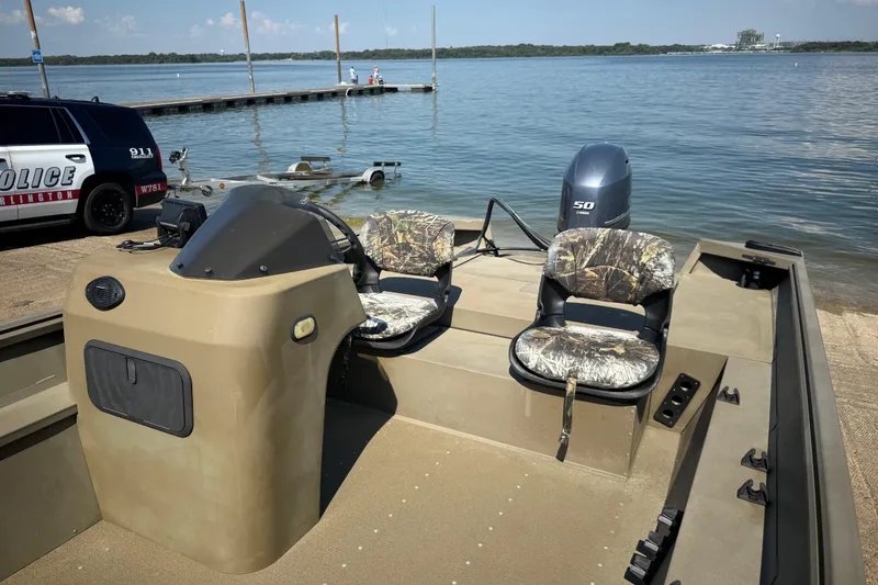 Slide: The Image of 2020 G3 Gator Tough 17 SC boat with camo seats and Yamaha motor by the water. - 25