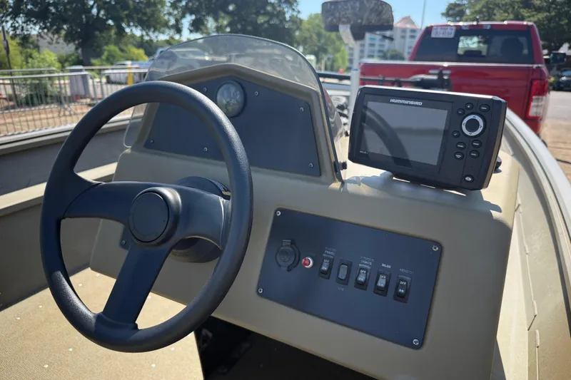 Slide: The Image of 2020 G3 Gator Tough 17 SC boat dashboard with Humminbird fish finder on calm water. - 27