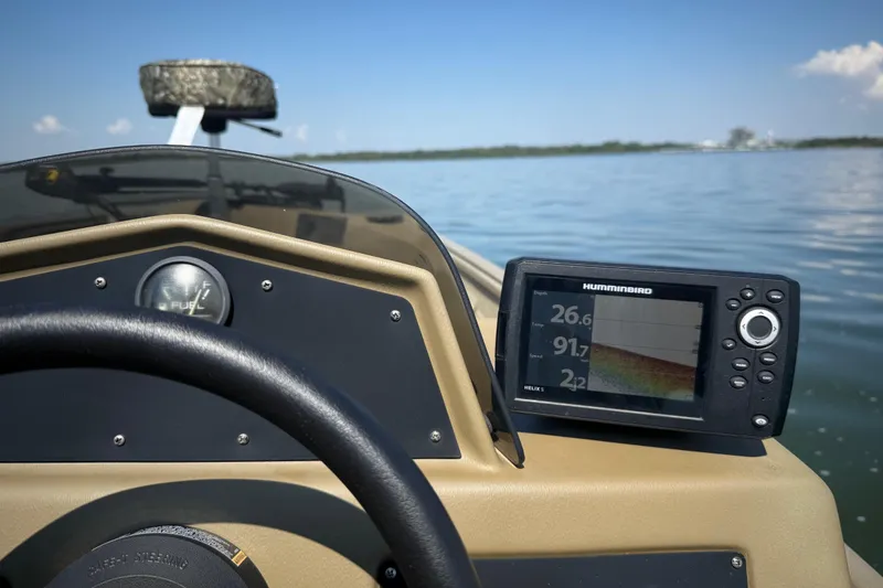 Slide: The Image of 2020 G3 Gator Tough 17 SC boat interior with camo seat and steering console. - 28