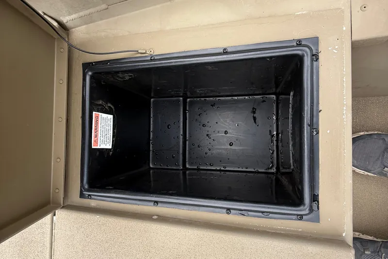 Slide: The Image of Boat motor and trailer hitch near a Ford F-150 in a parking lot. - 35