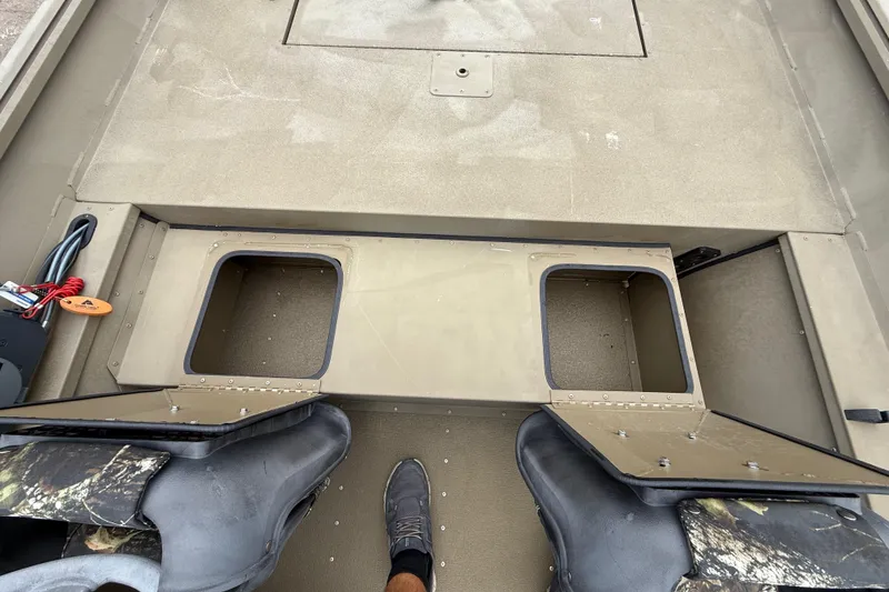 Slide: The Image of 2020 G3 Gator Tough 17 SC boat interior with rod holders and camo seat. - 37