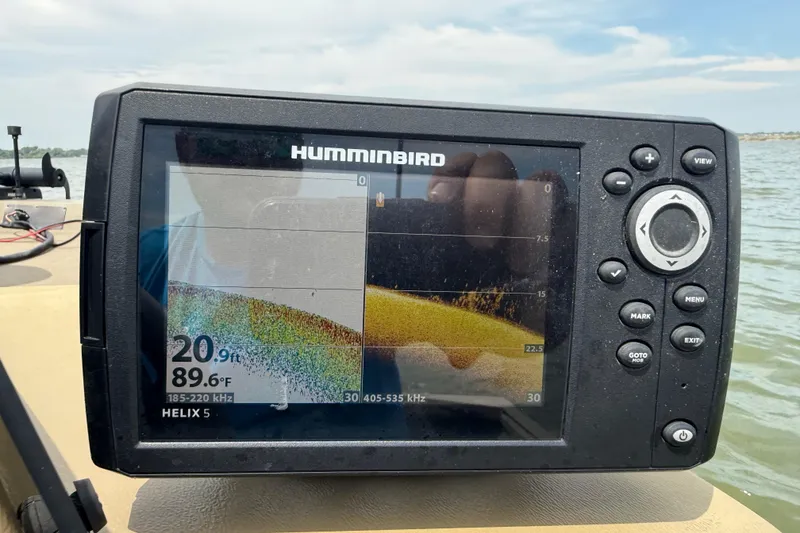 Slide: The Image of Fishfinder display on a 2020 G3 Gator Tough 17 SC boat, showing lake map and data. - 41