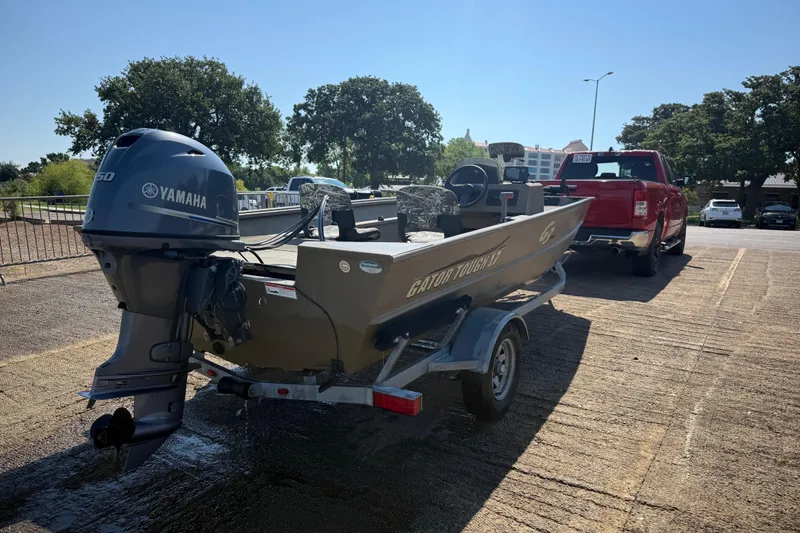 Slide: The Image of 2020 G3 Gator Tough 17 SC boat on trailer, Yamaha motor, parked by a red truck. - 7
