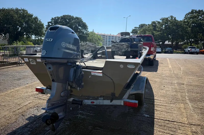 Slide: The Image of 2020 G3 Gator Tough 17 SC boat on trailer, Yamaha motor, parked near red truck. - 8