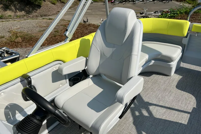 Slide: The Image of 2026 Tahoe Pontoon AURA 1985 boat interior with modern seating and steering wheel. - 10