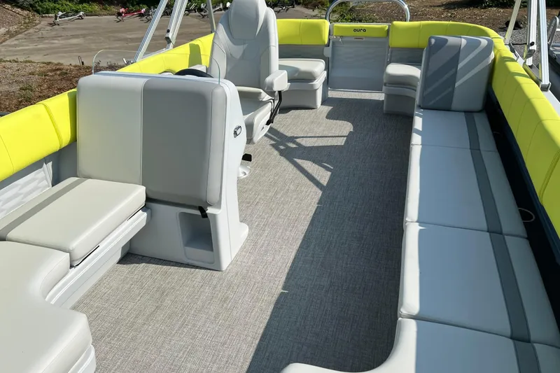 Slide: The Image of 2026 Tahoe Pontoon AURA 1985 interior with gray seating and yellow accents. - 14