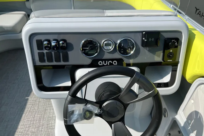 Slide: The Image of Steering console of 2026 Tahoe Pontoon AURA 1985 with modern controls and gauges. - 15