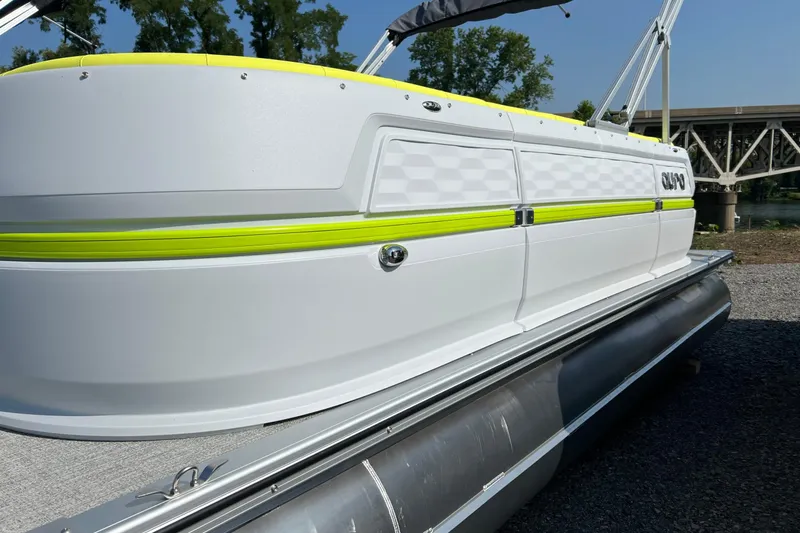 Slide: The Image of 2026 Tahoe Pontoon AURA 1985 with sleek design and vibrant accents by a river. - 4