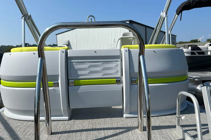 Slide: The Image of 2026 Tahoe Pontoon AURA 1985 with vibrant green accents and sleek design. - 7