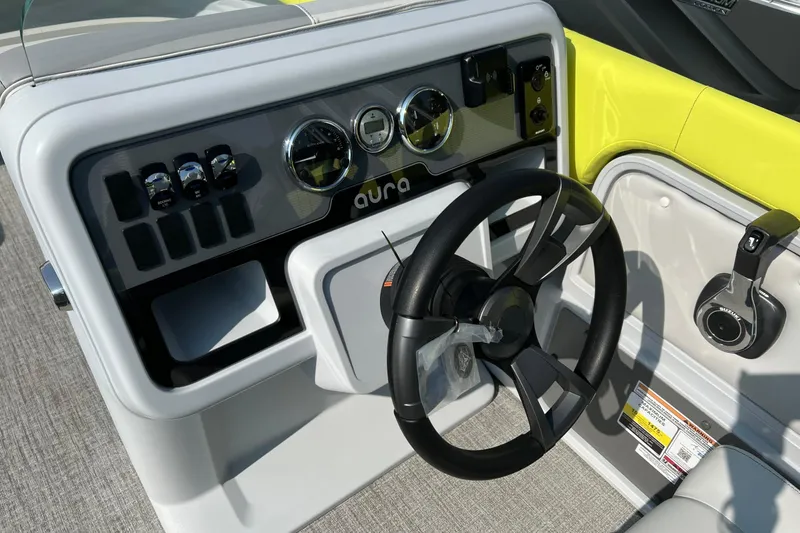 Slide: The Image of Steering console of 2026 Tahoe Pontoon AURA 1985 with modern controls and sleek design. - 9