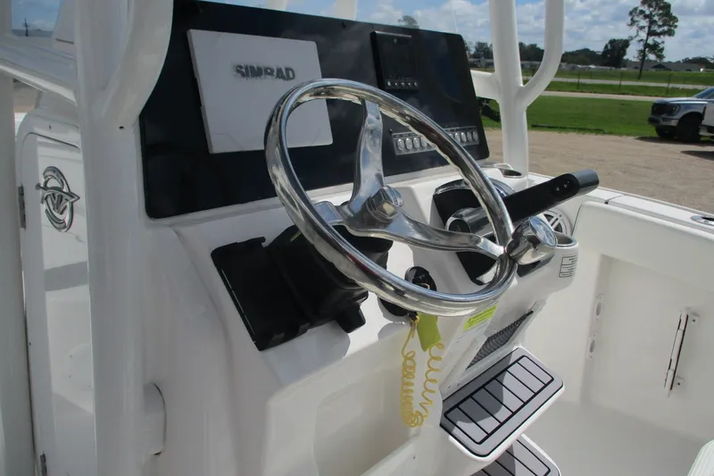 Slide: The Image of 2023 Tidewater 210 LXF boat steering console with Simrad display. - 13