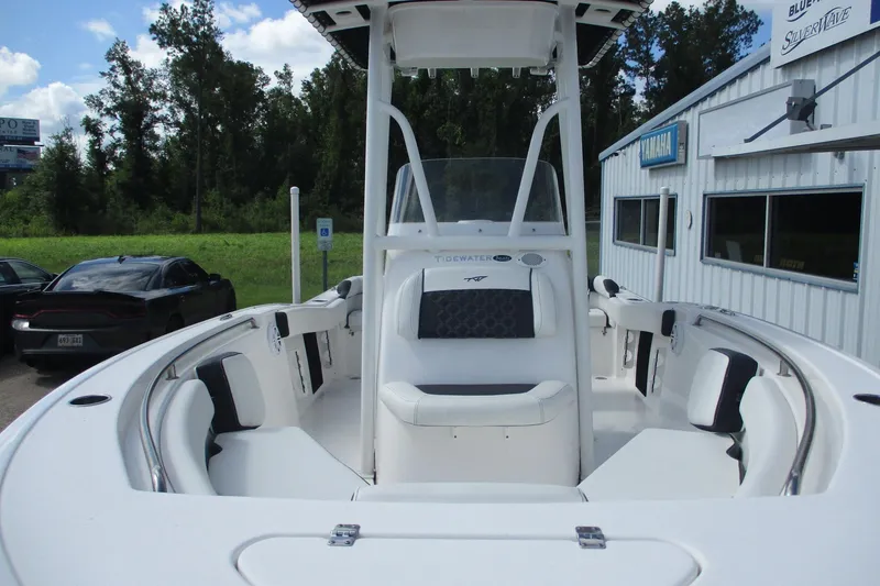 Slide: The Image of 2023 Tidewater 210 LXF boat with seating, parked near dealership. - 16