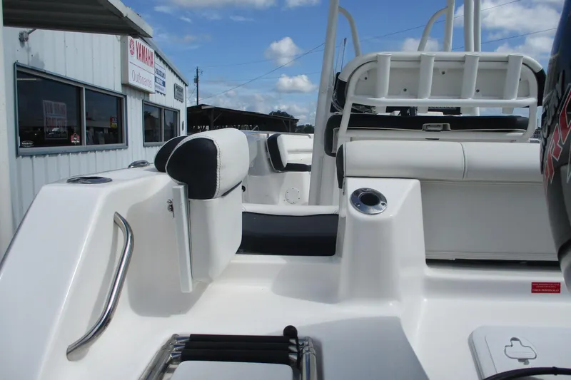 Slide: The Image of 2023 Tidewater 210 LXF boat interior with seating and Yamaha outboard motor. - 26