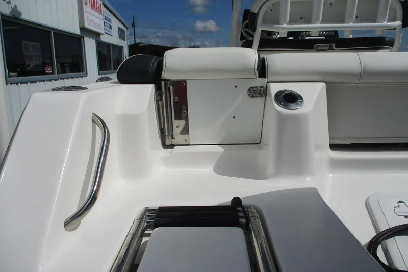 Slide: The Image of 2023 Tidewater 210 LXF boat interior with seating and storage compartments. - 27