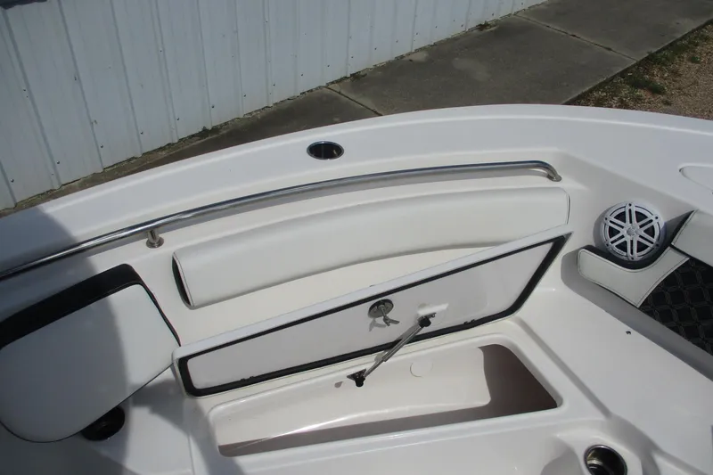 Slide: The Image of 2023 Tidewater 210 LXF boat interior with seating and speaker detail. - 7