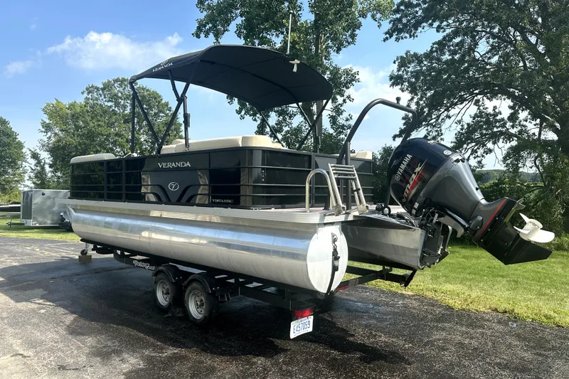 Slide: The Image of 2021 Veranda Vista 22RC pontoon boat on trailer with Yamaha outboard motor. - 10