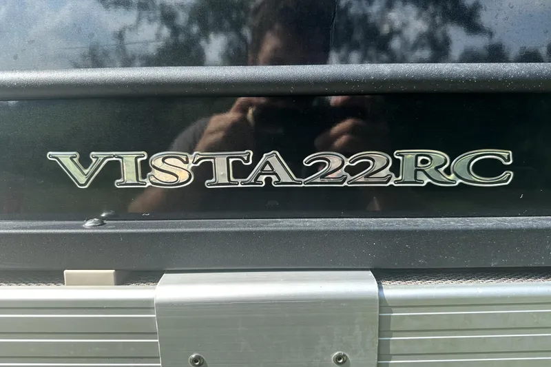 Slide: The Image of 2021 Veranda Vista 22RC logo on a black surface, close-up view. - 12